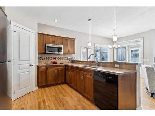 113 Tucker Circle, Okotoks, AB - Indoor Photo Showing Kitchen With Double Sink