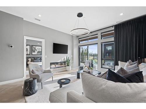 106-835 78 Street Sw, Calgary, AB - Indoor Photo Showing Living Room With Fireplace