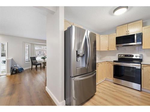 66 Erin Crescent Se, Calgary, AB - Indoor Photo Showing Kitchen With Stainless Steel Kitchen