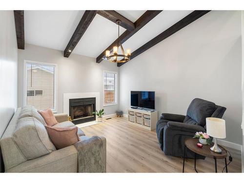 66 Erin Crescent Se, Calgary, AB - Indoor Photo Showing Living Room With Fireplace