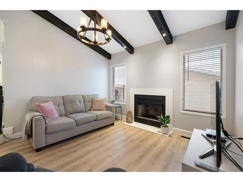 66 Erin Crescent Se, Calgary, AB - Indoor Photo Showing Living Room With Fireplace