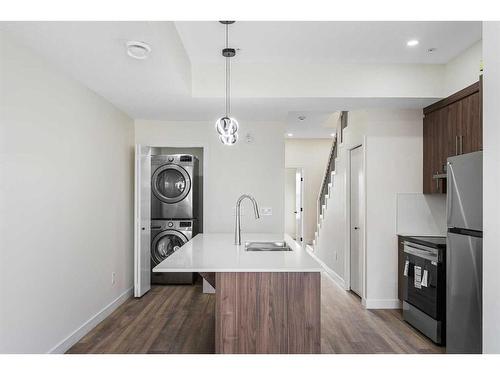 312-156 Park Street, Cochrane, AB - Indoor Photo Showing Kitchen With Double Sink