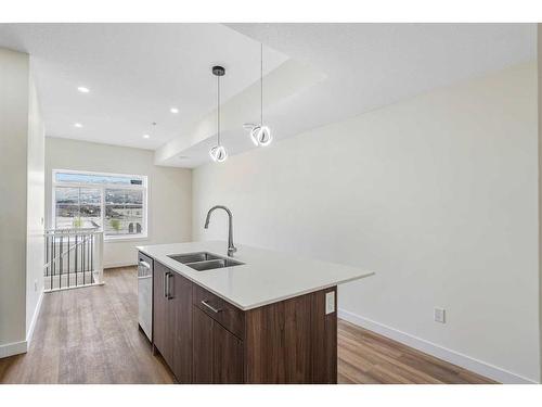 312-156 Park Street, Cochrane, AB - Indoor Photo Showing Kitchen With Double Sink With Upgraded Kitchen