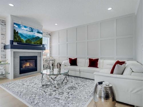 6 Cranbrook Circle Se, Calgary, AB - Indoor Photo Showing Living Room With Fireplace