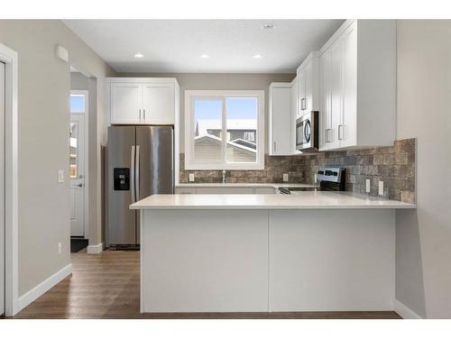 128 Heartland Boulevard, Cochrane, AB - Indoor Photo Showing Kitchen