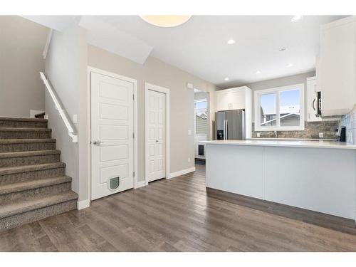 128 Heartland Boulevard, Cochrane, AB - Indoor Photo Showing Kitchen