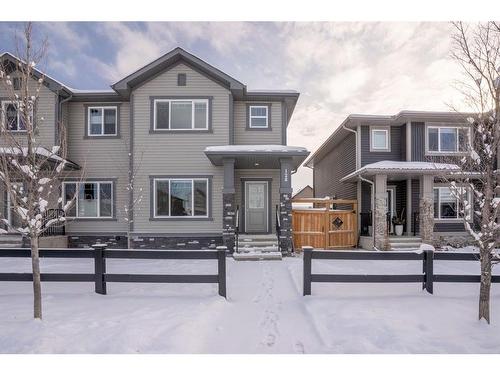 128 Heartland Boulevard, Cochrane, AB - Outdoor With Deck Patio Veranda With Facade