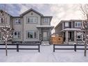 128 Heartland Boulevard, Cochrane, AB  - Outdoor With Deck Patio Veranda With Facade 