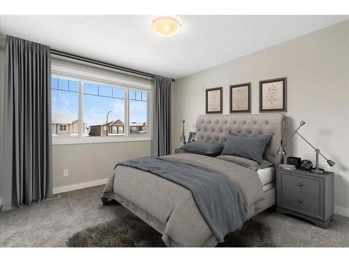 128 Heartland Boulevard, Cochrane, AB - Indoor Photo Showing Bedroom