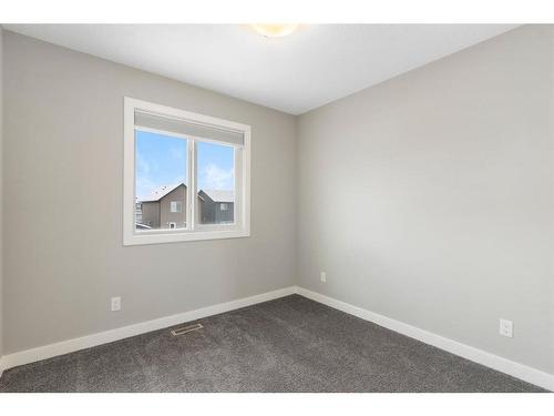 128 Heartland Boulevard, Cochrane, AB - Indoor Photo Showing Other Room