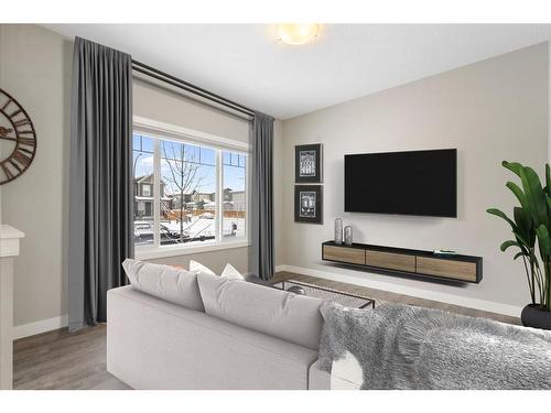 128 Heartland Boulevard, Cochrane, AB - Indoor Photo Showing Living Room