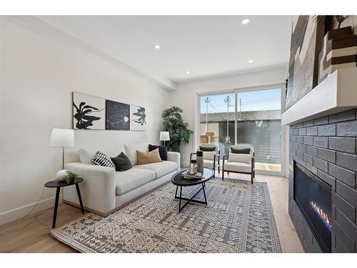 1423 Child Avenue Ne, Calgary, AB - Indoor Photo Showing Living Room With Fireplace