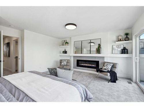 1423 Child Avenue Ne, Calgary, AB - Indoor Photo Showing Bedroom With Fireplace