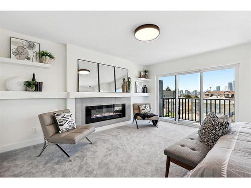 1423 Child Avenue Ne, Calgary, AB - Indoor Photo Showing Living Room With Fireplace