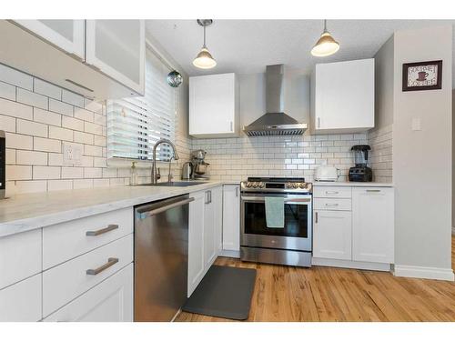 84 Glendale Way, Cochrane, AB - Indoor Photo Showing Kitchen With Stainless Steel Kitchen With Upgraded Kitchen