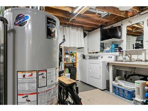 84 Glendale Way, Cochrane, AB - Indoor Photo Showing Laundry Room