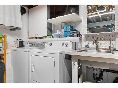 84 Glendale Way, Cochrane, AB - Indoor Photo Showing Laundry Room