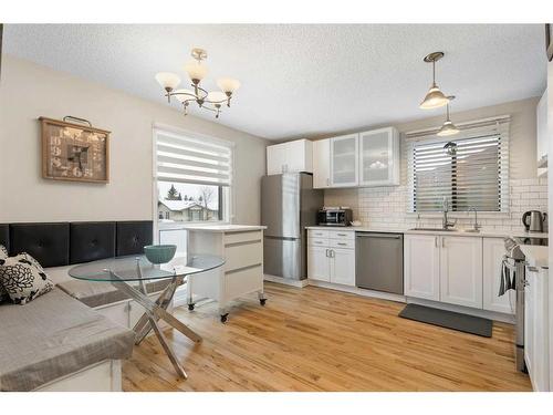 84 Glendale Way, Cochrane, AB - Indoor Photo Showing Kitchen With Upgraded Kitchen