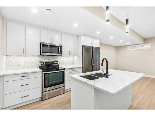 2019 21 Avenue Nw, Calgary, AB - Indoor Photo Showing Kitchen With Stainless Steel Kitchen With Double Sink With Upgraded Kitchen