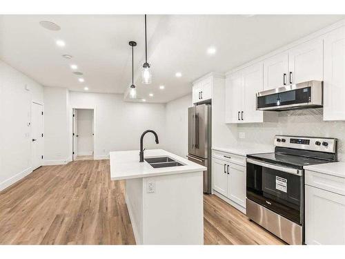 2019 21 Avenue Nw, Calgary, AB - Indoor Photo Showing Kitchen With Stainless Steel Kitchen With Double Sink With Upgraded Kitchen