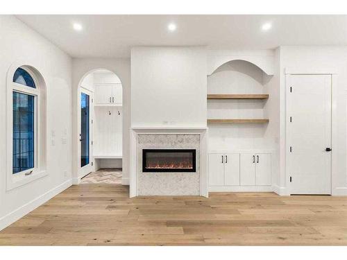 2019 21 Avenue Nw, Calgary, AB - Indoor Photo Showing Other Room With Fireplace