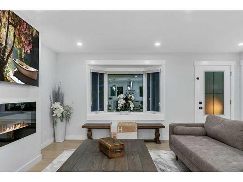 7027 Huntbourne Green Ne, Calgary, AB - Indoor Photo Showing Living Room With Fireplace