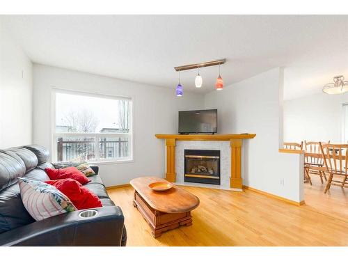 224 Tuscarora Heights Nw, Calgary, AB - Indoor Photo Showing Living Room With Fireplace