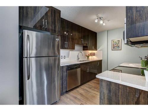 406-607 17 Avenue Nw, Calgary, AB - Indoor Photo Showing Kitchen With Stainless Steel Kitchen