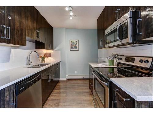 406-607 17 Avenue Nw, Calgary, AB - Indoor Photo Showing Kitchen With Stainless Steel Kitchen With Double Sink With Upgraded Kitchen