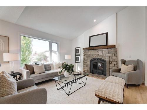 14 West Hall Place, Cochrane, AB - Indoor Photo Showing Living Room With Fireplace