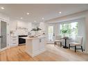 14 West Hall Place, Cochrane, AB  - Indoor Photo Showing Kitchen With Upgraded Kitchen 