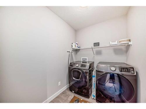 1-2420 30 Street Sw, Calgary, AB - Indoor Photo Showing Laundry Room