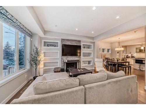 1-2420 30 Street Sw, Calgary, AB - Indoor Photo Showing Living Room With Fireplace