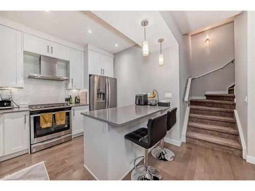 1-2420 30 Street Sw, Calgary, AB - Indoor Photo Showing Kitchen With Stainless Steel Kitchen With Upgraded Kitchen