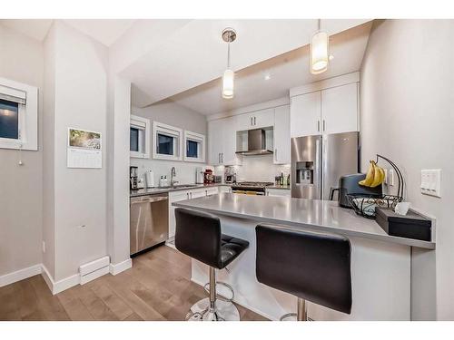 1-2420 30 Street Sw, Calgary, AB - Indoor Photo Showing Kitchen With Stainless Steel Kitchen With Double Sink With Upgraded Kitchen