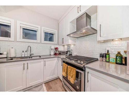 1-2420 30 Street Sw, Calgary, AB - Indoor Photo Showing Kitchen With Double Sink With Upgraded Kitchen