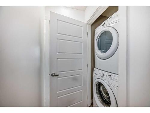 67 Cranford Way Se, Calgary, AB - Indoor Photo Showing Laundry Room