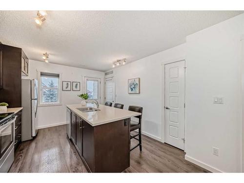 67 Cranford Way Se, Calgary, AB - Indoor Photo Showing Kitchen With Double Sink