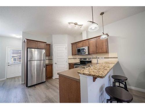 4002-1001 8 Street Nw, Airdrie, AB - Indoor Photo Showing Kitchen With Stainless Steel Kitchen