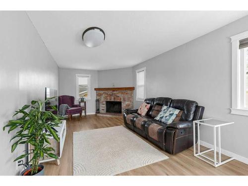 1311 Osler Street, Carstairs, AB - Indoor Photo Showing Living Room With Fireplace