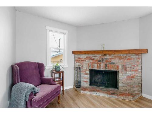 1311 Osler Street, Carstairs, AB - Indoor Photo Showing Living Room With Fireplace