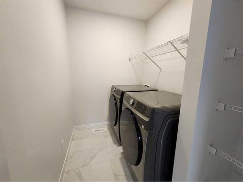 495 Lucas Boulevard Nw, Calgary, AB - Indoor Photo Showing Laundry Room