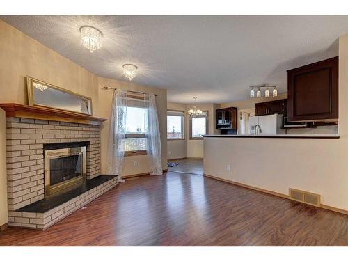 28 Hawkdale Close Nw, Calgary, AB - Indoor Photo Showing Living Room With Fireplace