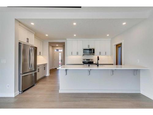 23 Wolf Hollow Road Se, Calgary, AB - Indoor Photo Showing Kitchen With Stainless Steel Kitchen With Upgraded Kitchen