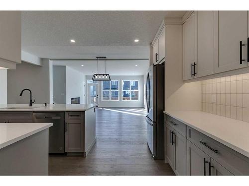 23 Wolf Hollow Road Se, Calgary, AB - Indoor Photo Showing Kitchen With Upgraded Kitchen