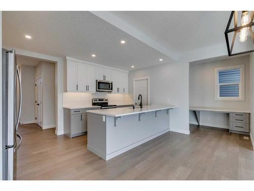 23 Wolf Hollow Road Se, Calgary, AB - Indoor Photo Showing Kitchen With Upgraded Kitchen