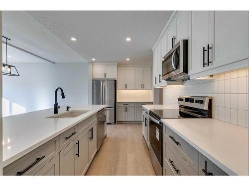 23 Wolf Hollow Road Se, Calgary, AB - Indoor Photo Showing Kitchen With Stainless Steel Kitchen With Upgraded Kitchen