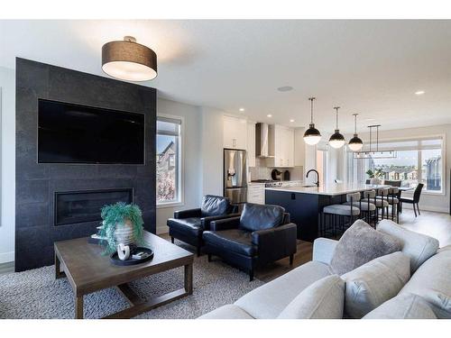 24 Royal Elm Green Nw, Calgary, AB - Indoor Photo Showing Living Room With Fireplace