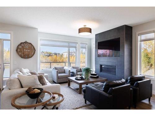 24 Royal Elm Green Nw, Calgary, AB - Indoor Photo Showing Living Room With Fireplace