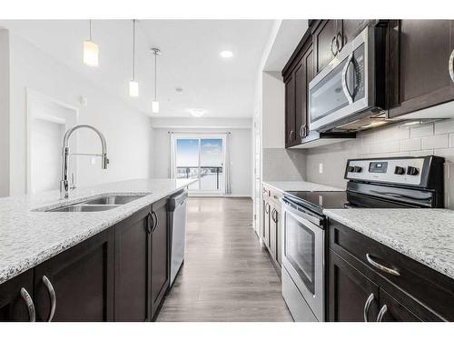 330-20 Seton Park Se, Calgary, AB - Indoor Photo Showing Kitchen With Double Sink With Upgraded Kitchen